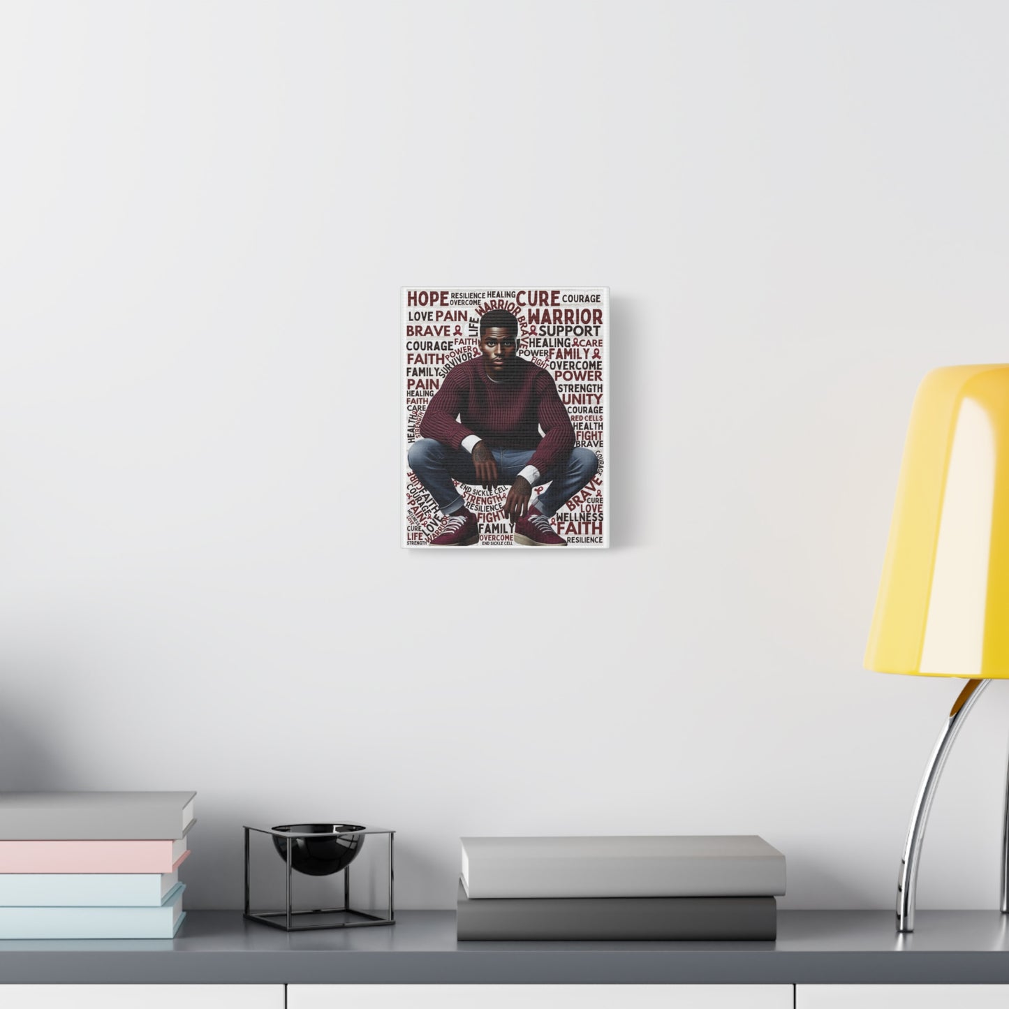 Poster of a person with motivational text on a wall above a desk with books and a lamp.