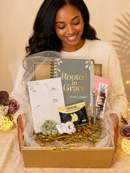 Woman holding a gift box with 'Rooted in Grace' planner and other items.